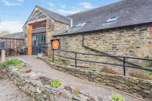 a stone building with a stone stairway leading up to it at 2 Bed in Keswick oc-28377 in Braithwaite