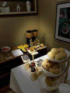 a table with two plates of food on a table at Brava Hotel in Ibadan
