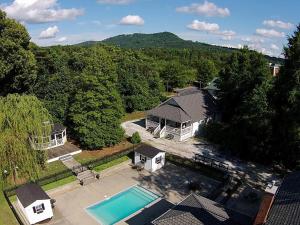 an aerial view of a house with a swimming pool at Swamp Rabbit Inn TR in Travelers Rest +1 photo
