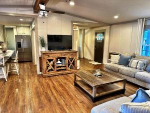 a living room with a couch and a coffee table at Charming Lake Front Home and Pavilion in Milledgeville
