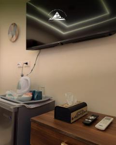 a room with a table with a box on it at Pyramids Green View in Cairo +18 photos