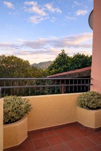 a balcony with a view of the mountains at Casa Lucia vicino al mare in Budoni