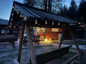 a gazebo with lights on top of it at Tinaraft camp in Radovljica