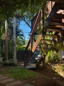 a wooden staircase leading up to a house at Floripa Beach House Hostel in Florianópolis