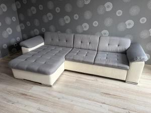 a couch sitting in a living room with at Lielais prospekts 54 in Ventspils