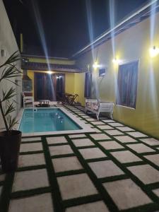 a swimming pool in the middle of a room at CASA TEMPORADA BARREIRINHAS Yellow 3 in Barreirinhas