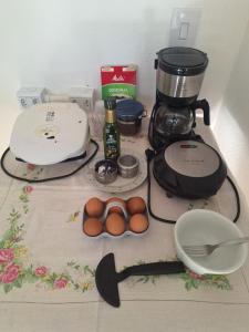a counter with a coffee maker and eggs on it at Recanto Ursa Maior in Monte Verde