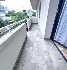 a balcony of a building with a walkway at Casa vacanza Emily in Pedaso +3 photos