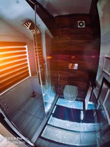 a view of a sauna with a glass floor in a room at casa Verde Kochi in Cochin