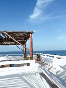 a view of the ocean from the deck of a beach house at Kay Apartments Isla Mujeres in Isla Mujeres