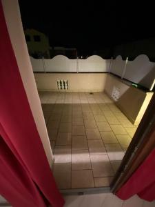 an overhead view of a bathroom with a tiled floor at Borghaus Iseo in Iseo