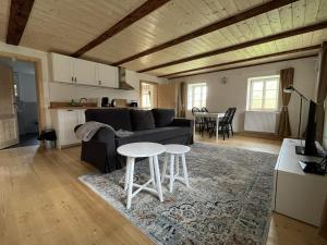a living room with a couch and a table at Vierseithof "Waitzdorfer Hof" in Hohnstein