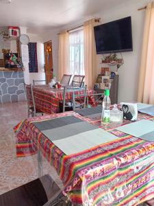 a living room with a table with a blanket on it at Misky Wasi in San Pedro de Atacama