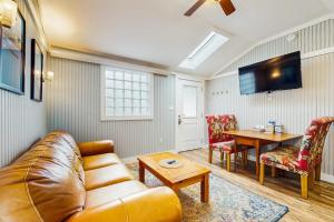 a living room with a couch and a table at Shorelands Resort Cottage 40 in Kennebunk