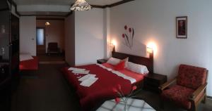 A bed or beds in a room at Hotel Pavla Vysočina
