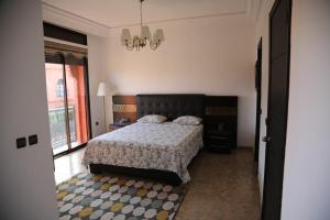 a bedroom with a bed and a large window at villa Marrakech 3chambre in Marrakesh +11 photos