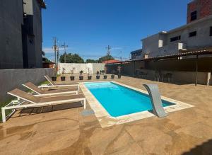 a swimming pool on top of a building at GB Hotéis Foz Rodoviária in Foz do Iguaçu