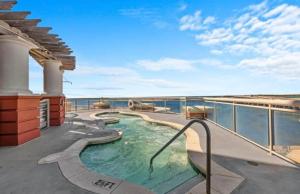 a swimming pool on the deck of a cruise ship at Breathtaking Views Emerald Grande 3BR,2BA 904E in Destin