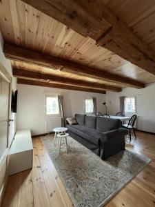 a living room with a couch and a table at Vierseithof "Waitzdorfer Hof" in Hohnstein