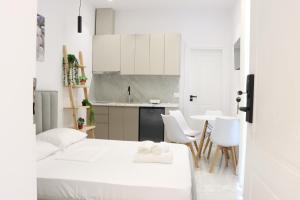 a small apartment with two beds and a kitchen at Aura boutique hotel in Vlorë