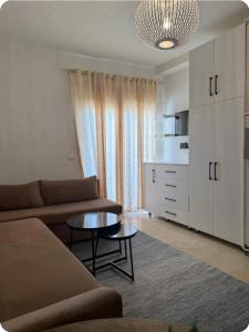 a living room with a couch and a coffee table at Coin de Mire in Hammam Sousse