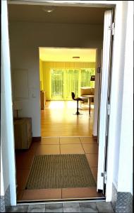 a view of a living room from an open door at Barrierefreie Ferienwohnung in Bad Windsheim