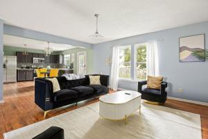 a living room with a couch and a table at Quiet Avon Retreat in Indianapolis