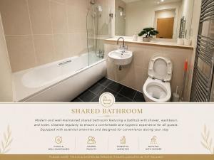 a bathroom with a sink and a tub and a toilet at Stunning City Centre Retreat in Birmingham