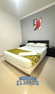a large bed in a room with at Hospedaje El Lorito in Barranquilla +7 photos