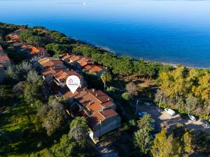 an aerial view of a village next to the water at Blue View - A Due Passi dal Mare & Natura in Quartu SantʼElena