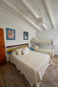 a bedroom with a bed in a room at BARRIO VIEJO in Los Reartes