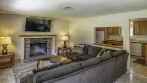 a living room with a couch and a fireplace at Centrally Located, Outdoor Dinning and Game Table in Barnstable