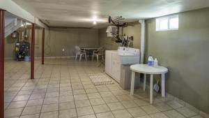 a room with a kitchen with a table and a table at Centrally Located, Outdoor Dinning and Game Table in Barnstable +14 photos