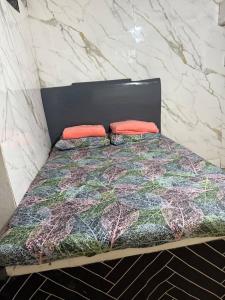 a bed with two pillows on top of it at PrincessStar in Pagadian