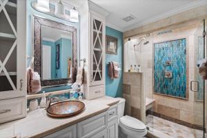 a bathroom with a sink and a shower at Luxury Beachfront Condo Free Beach Chairs Huge Balcony Come Relax! in Panama City Beach +33 photos