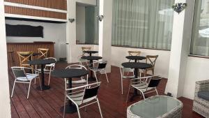a group of tables and chairs on a deck at Hotel Azul by MH in Punta del Este +35 photos