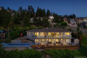 a large house with a lot of lights on at Lakeview Bed and Breakfast in Kelowna