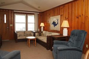 a living room with a couch and two chairs at Blue Haven by Oak Island Accommodations in Oak Island +31 photos
