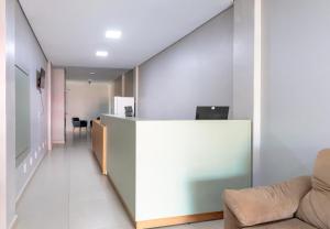 an office with a long hallway with a reception counter at GB Hotéis Foz Centro in Foz do Iguaçu +14 photos