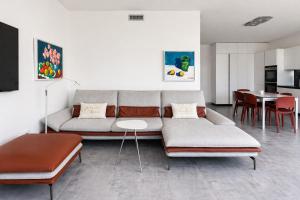 a living room with a couch and a table at Apartment Lana, Gera Lario in Gera Lario