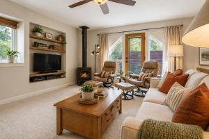 a living room with a couch and a fireplace at Aspen Townhome with Deck - Restaurant Row in Aspen