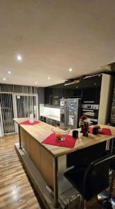a kitchen with a large island in a kitchen at Billet Senior in Fredrikstad