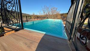a swimming pool on the balcony of a house at Casa La Cañada by CasaTuristica in Ronda