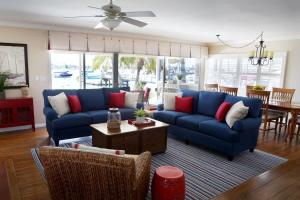 a living room with blue couches and a table at 1400 South Bayfront in Newport Beach