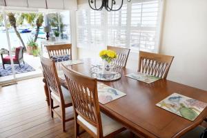 a dining room with a wooden table and chairs at 1400 South Bayfront in Newport Beach