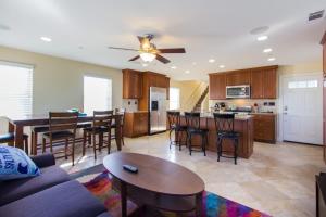 a kitchen and living room with a couch and a table at 209 38th St. B Condo in Newport Beach