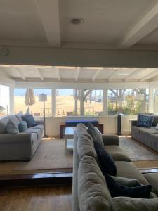a living room with a couch and a table at 1002 East Oceanfront in Newport Beach