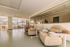 a living room with a couch and chairs and a table at TheLifeCo Sharm El Sheikh in Sharm El Sheikh