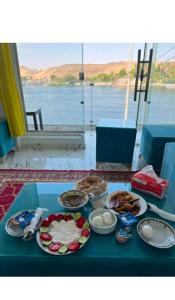 a table with plates of food on top of it at Esmerada in Aswan