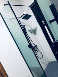 a glass door with a handle in a room at Admiralty in Araromi +2 photos